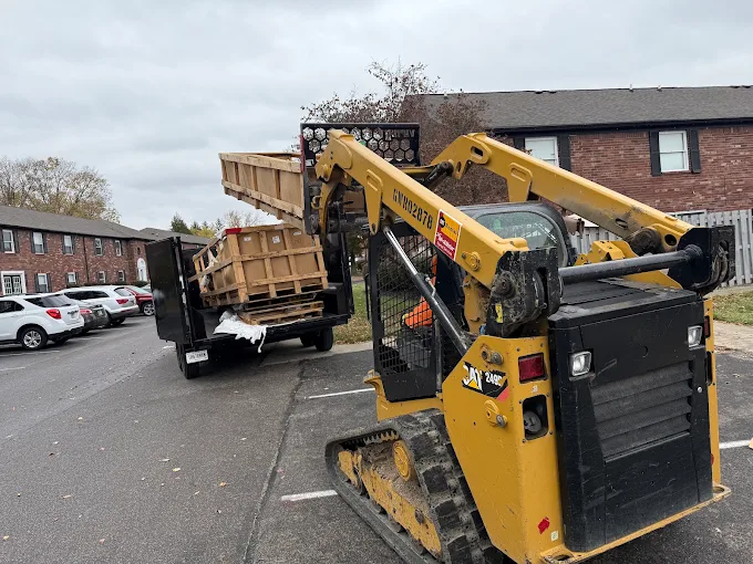 Gone Today Hauling CAT 249D3 skid steer loading dumpsters with grapple bucket on a Central Indiana job